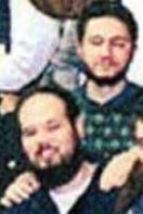 Mohamed Atta has his hands on the shoulders of Mohammed Rajih in a portion of a 1999 group photo.